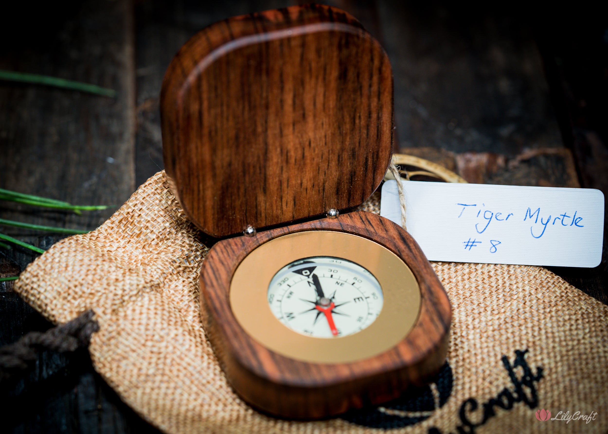 Artisanal compass crafted from sustainably sourced rare woods.