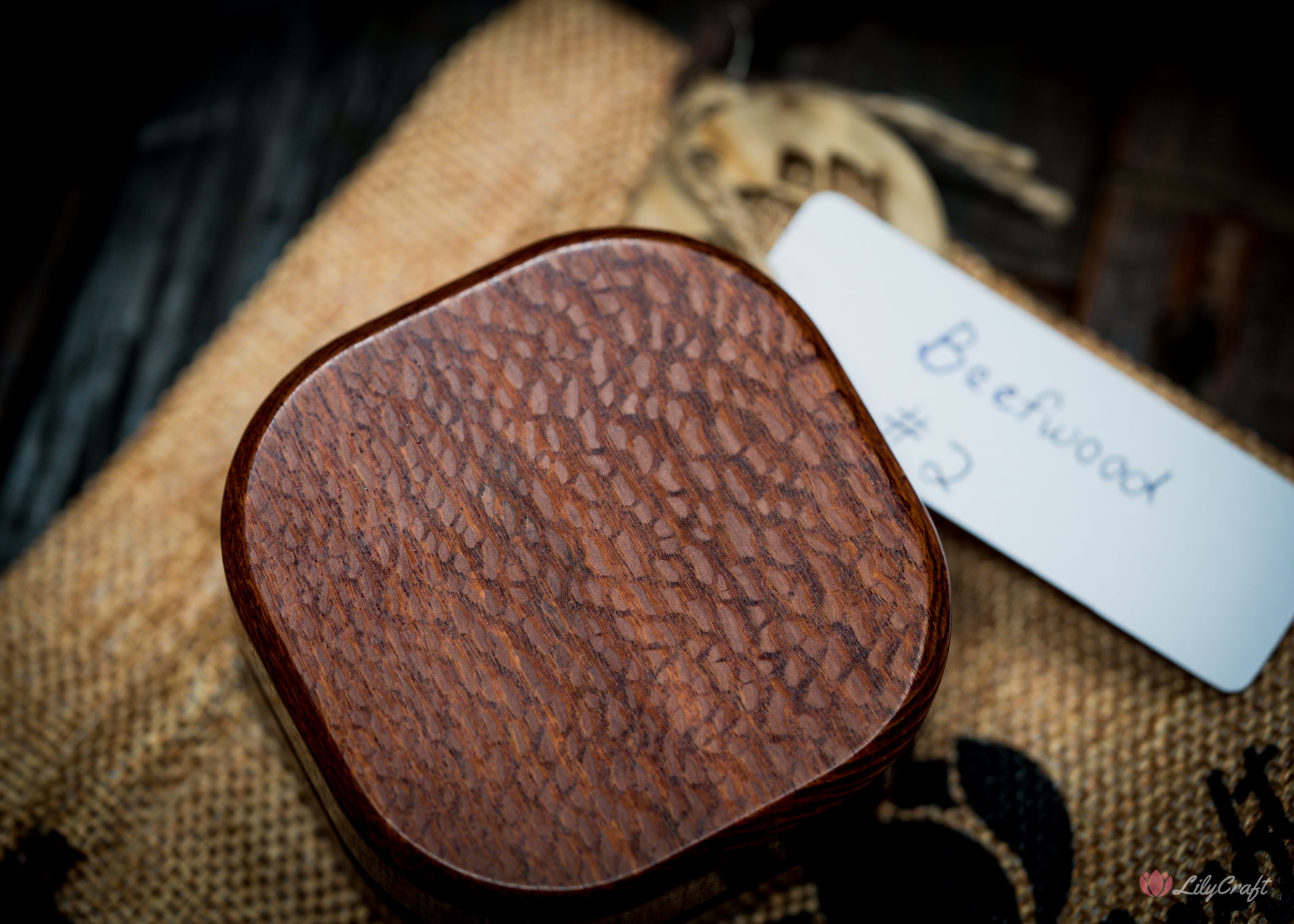 Rare wooden compass presented in an eco-friendly hessian bag.