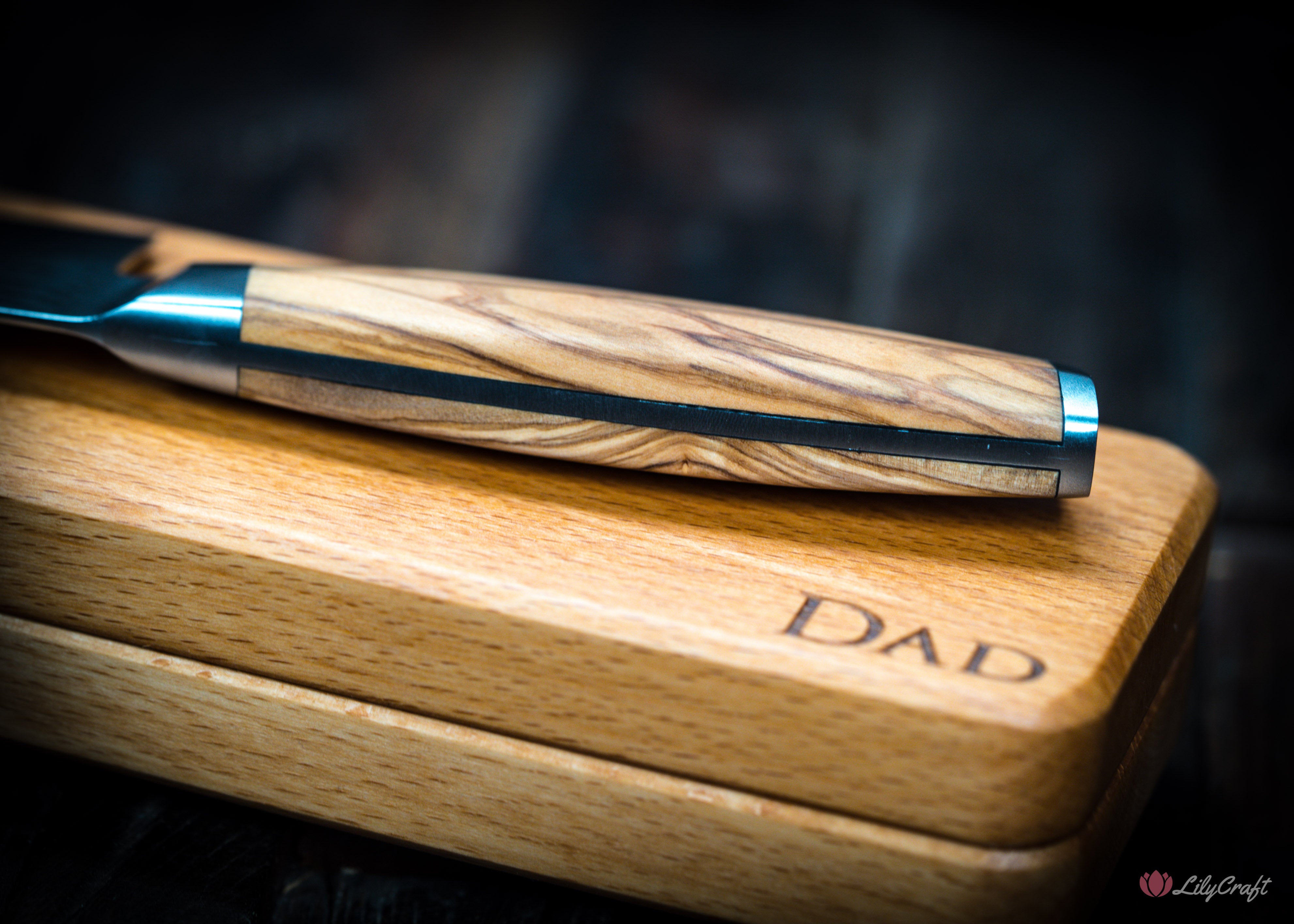 Damascus-style chef knife with ergonomic wood grip