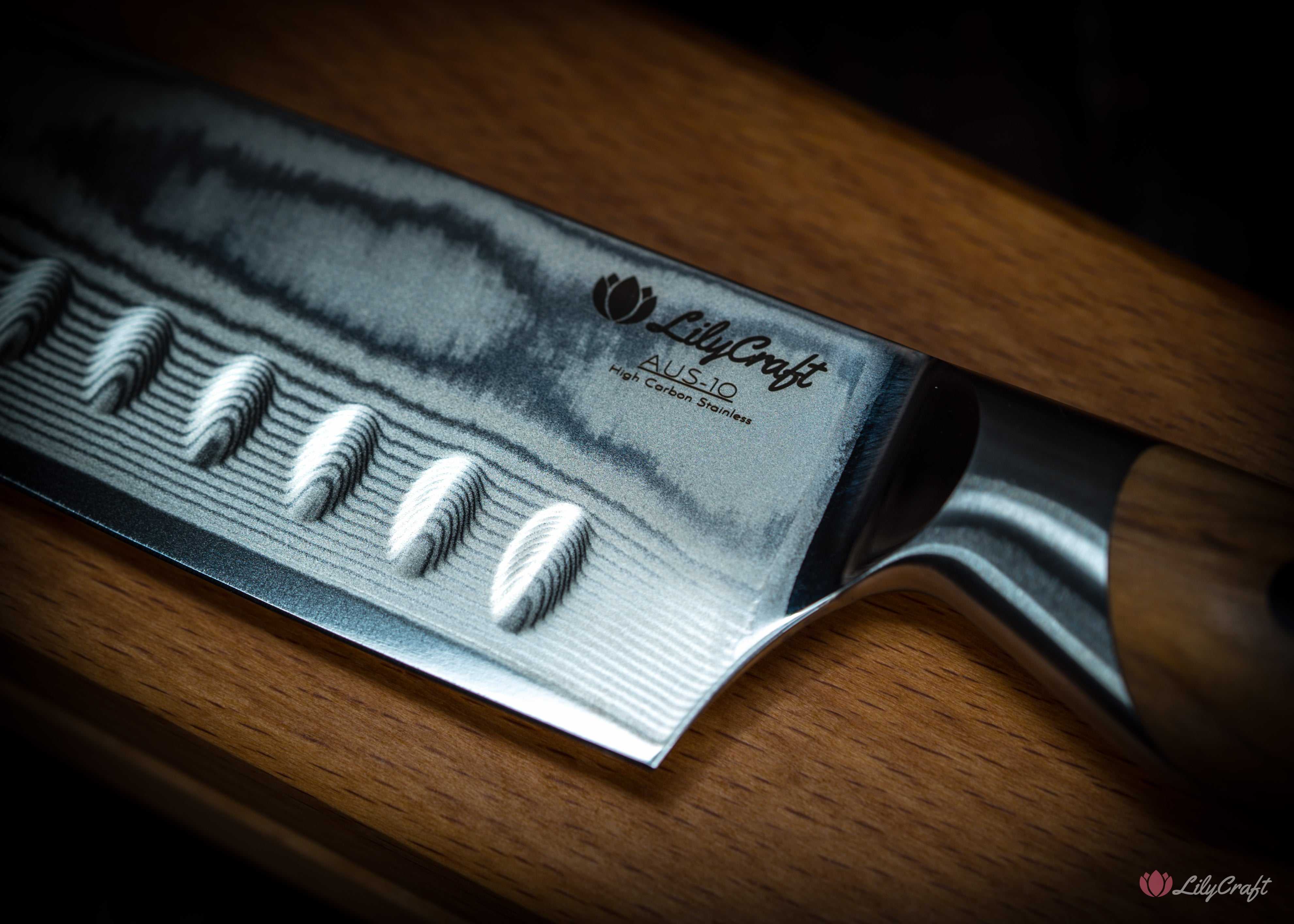 Sharp Japanese cooking knife with olive wood handle