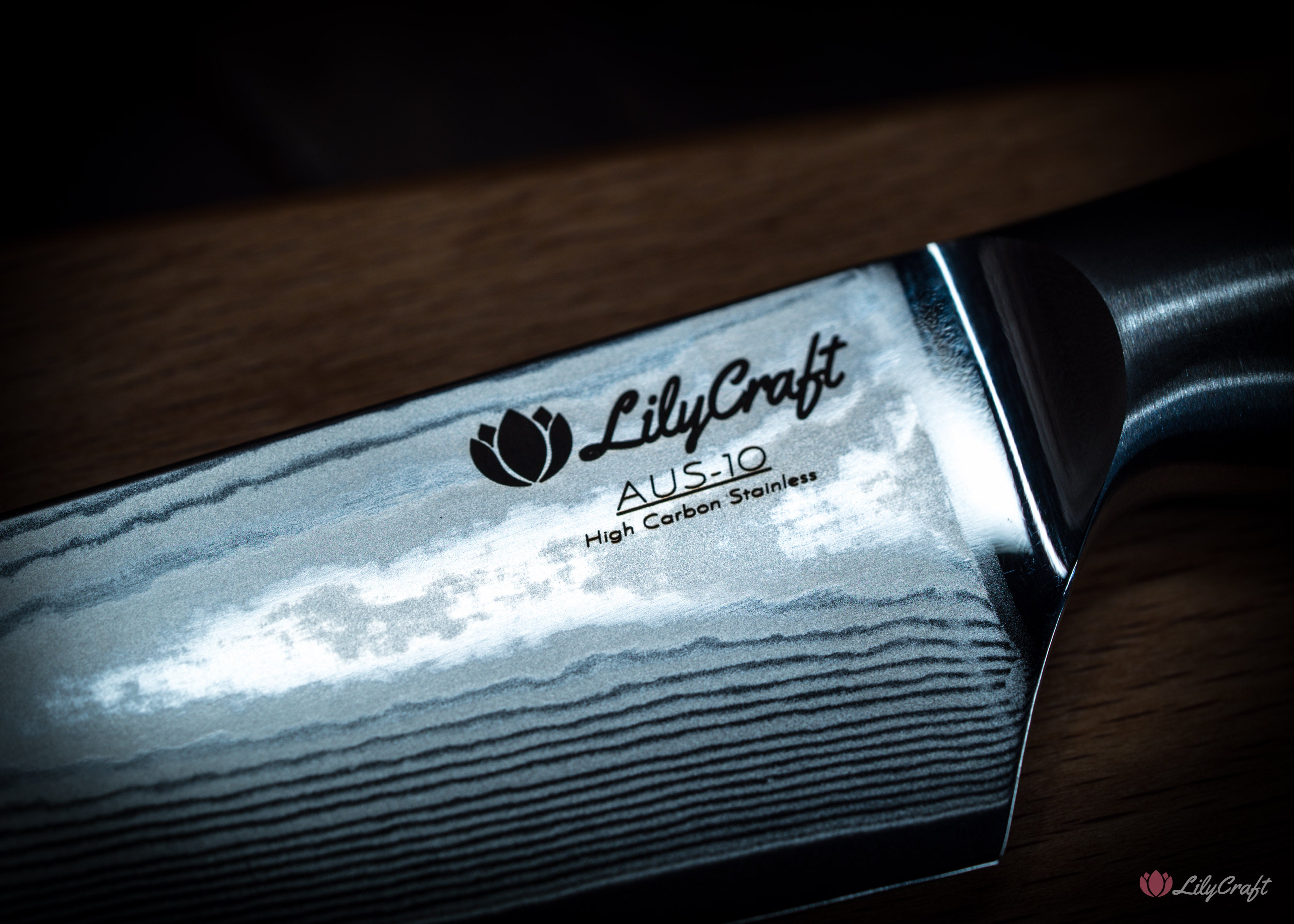 Damascus utility knife with natural olive wood handle