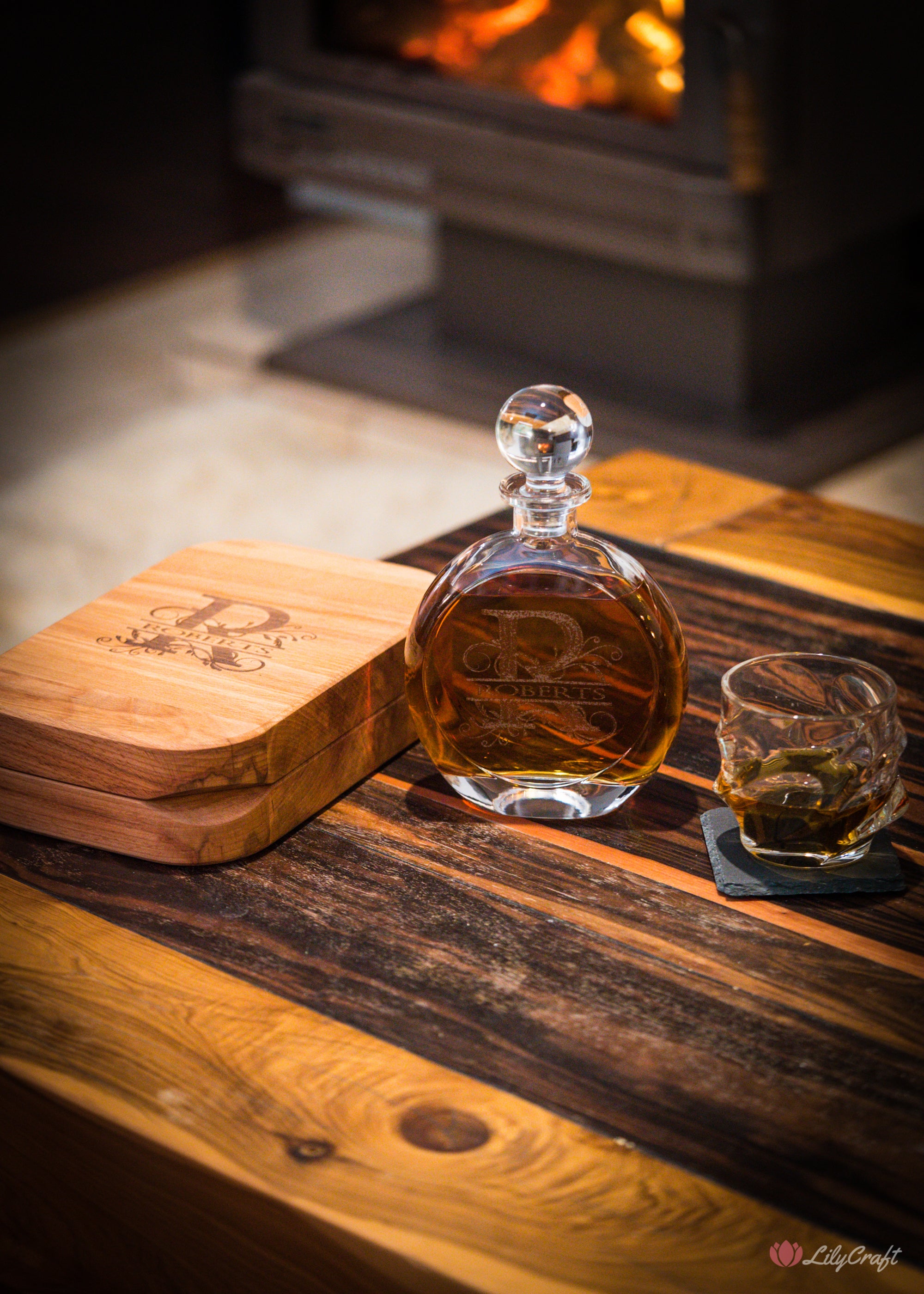 Custom bourbon decanter with engraved glass and wooden case.