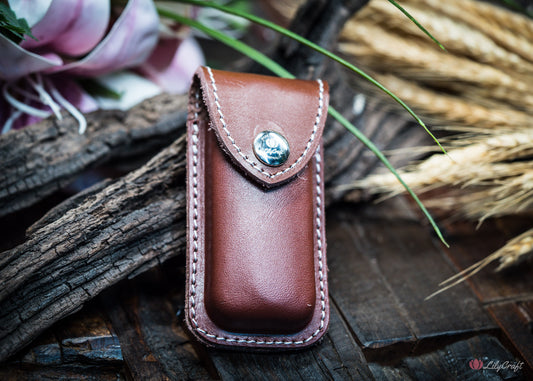 Brown leather sheath for folding knife with metal clip