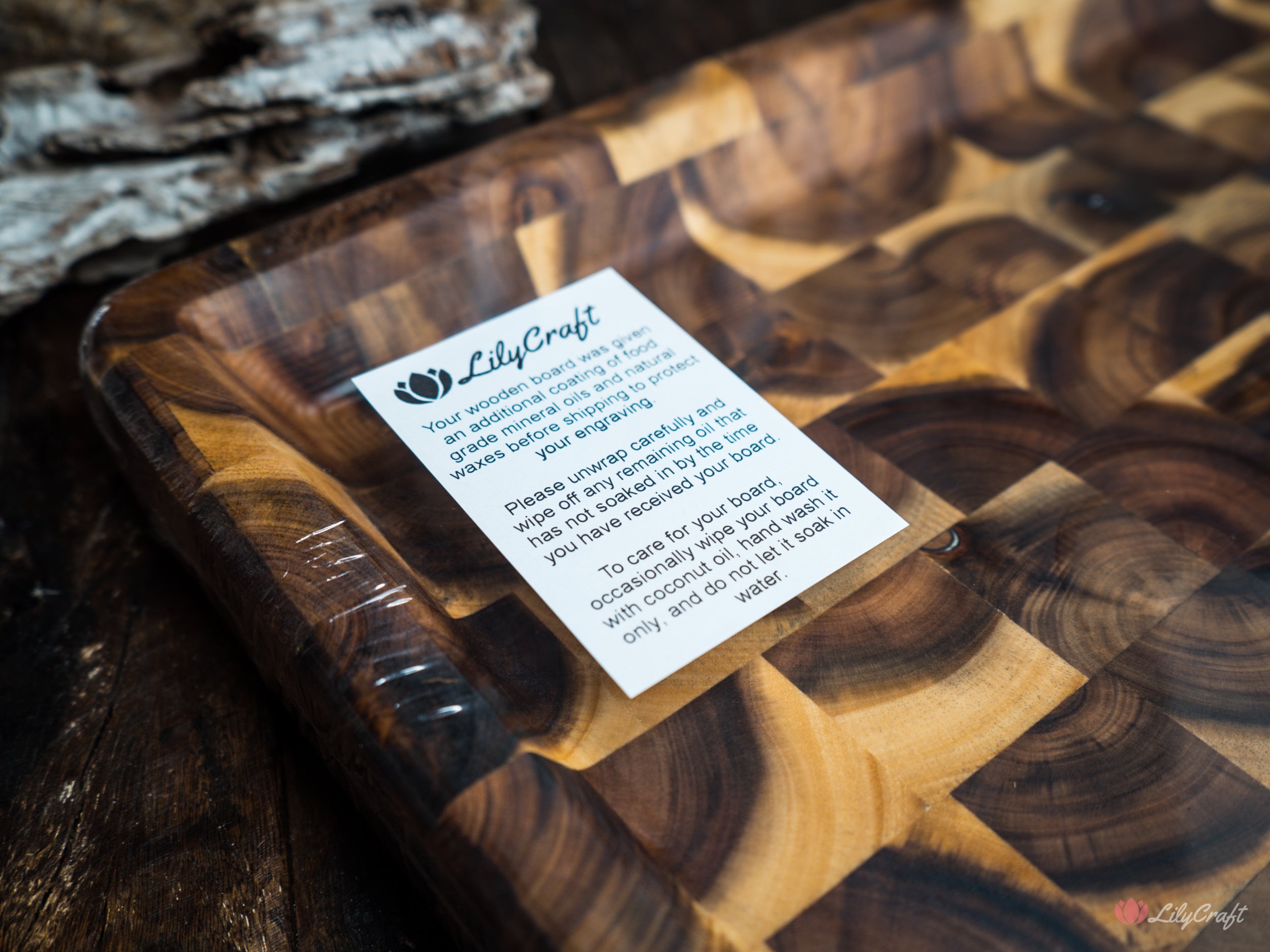 An endgrain butcher's block BBQ cutting board with a juice trough to catch meat juices and prevent messes.