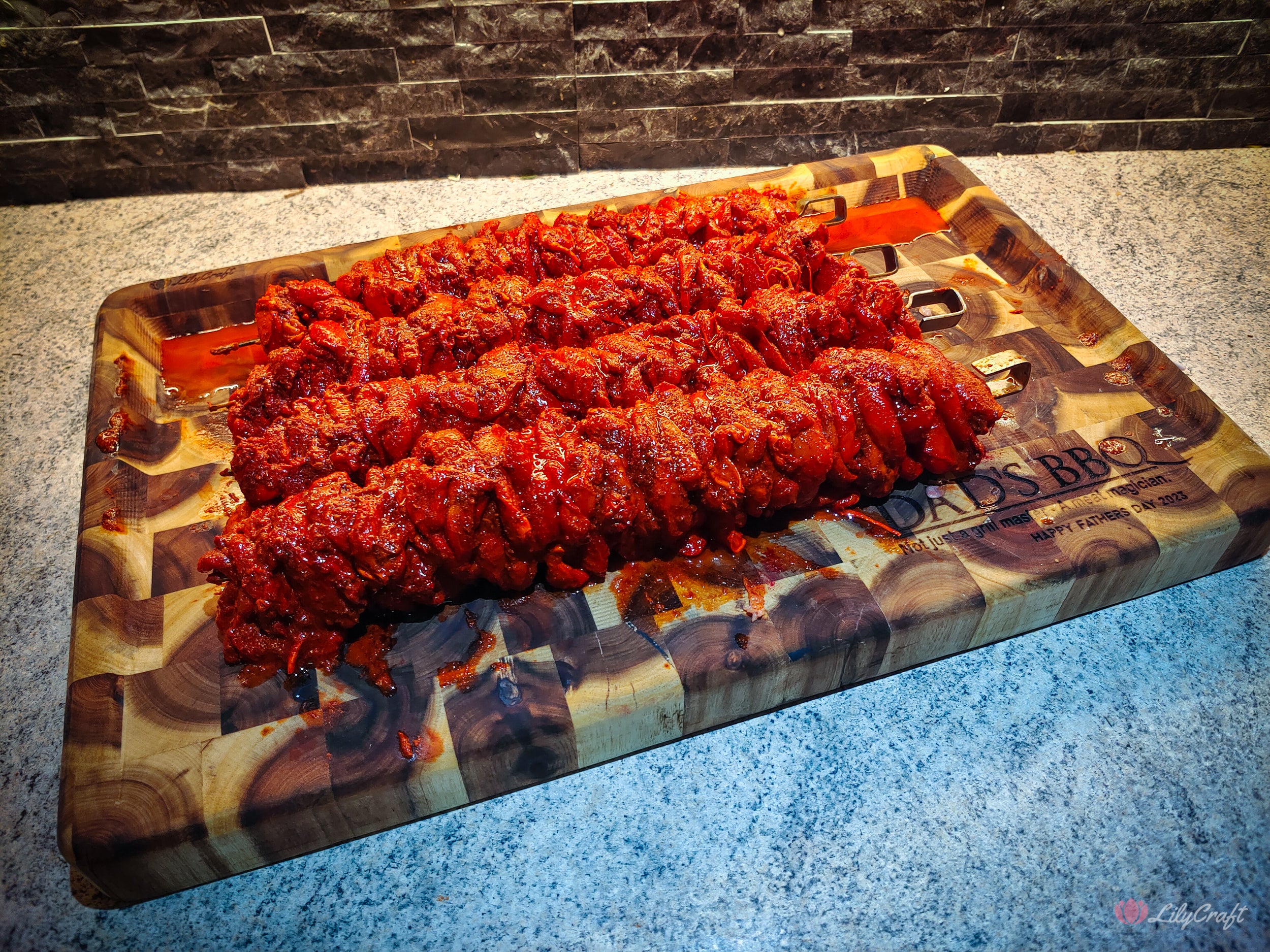An endgrain butcher's block BBQ cutting board with deep grooves to prevent meat juices from spilling.