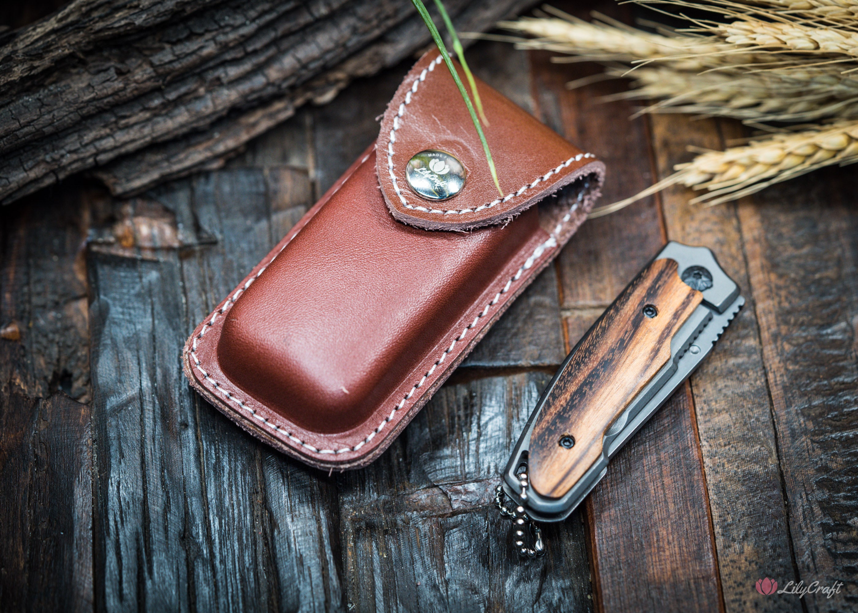Knife pouch on belt shown with multitool inserted