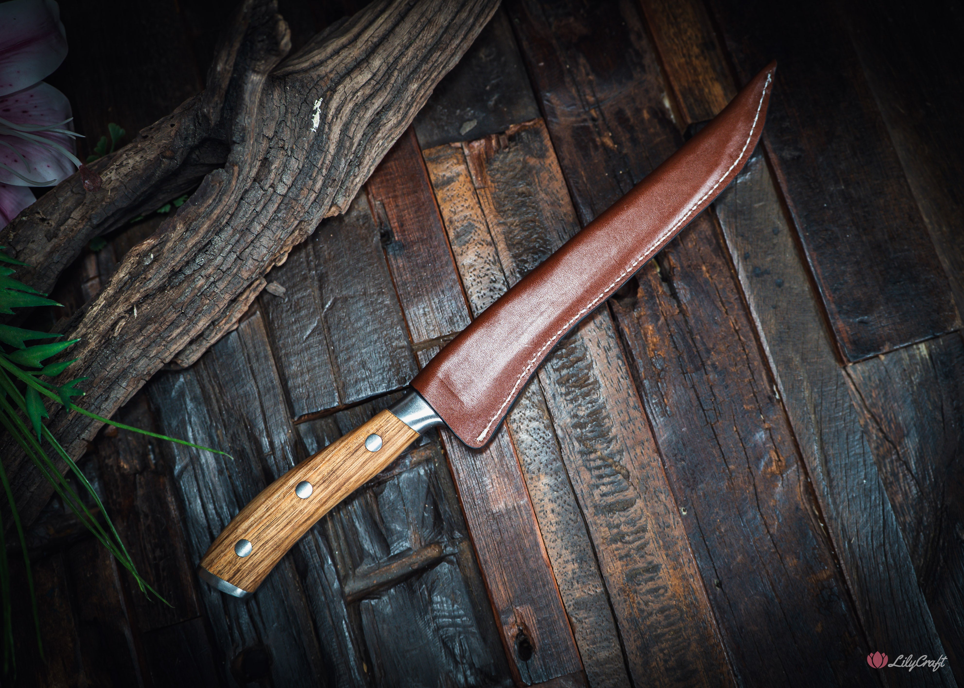 Aussie fisherman cleaning fish with flexible zebra wood filleting blade
