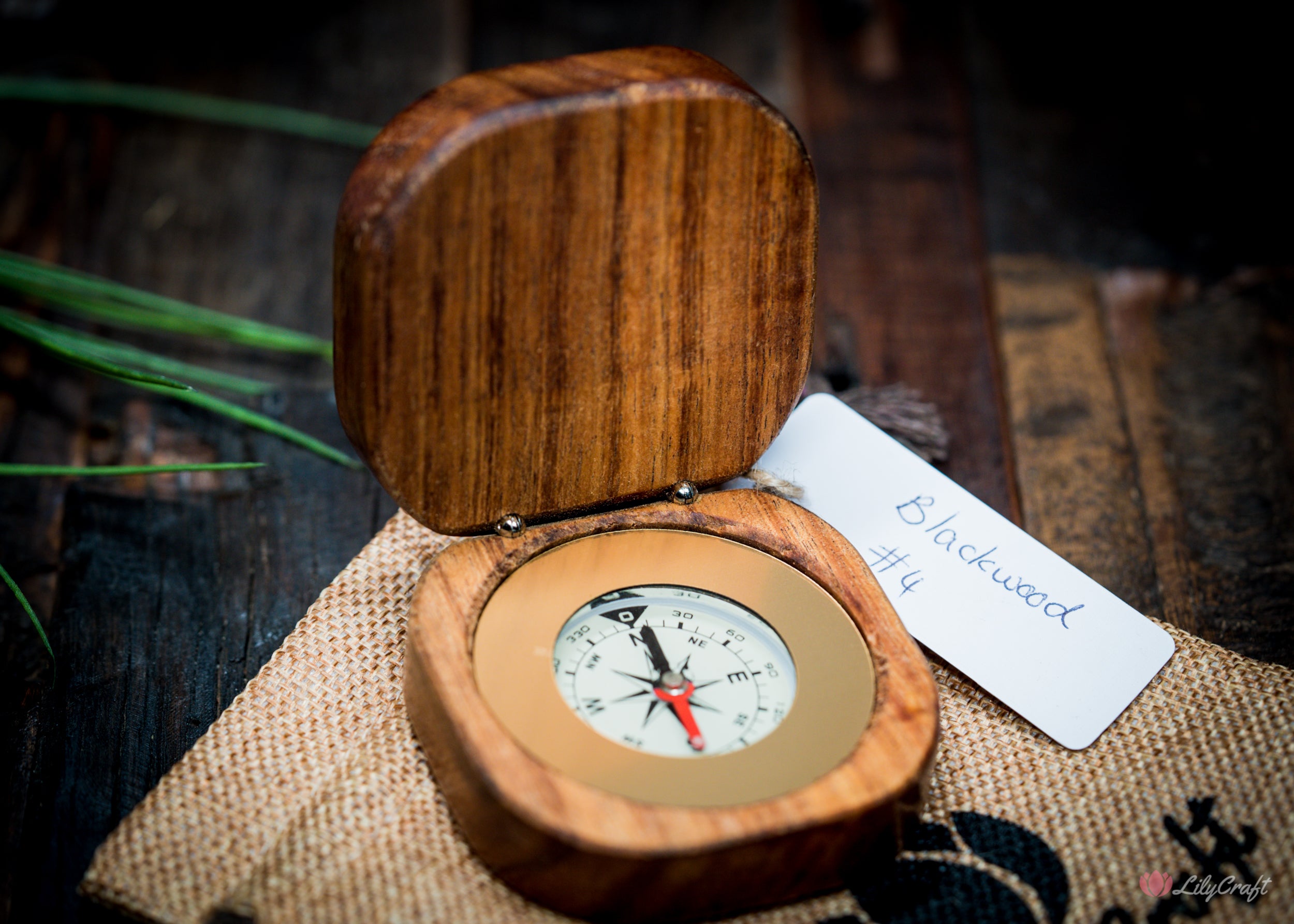 Handmade compass showcasing natural wood grain.