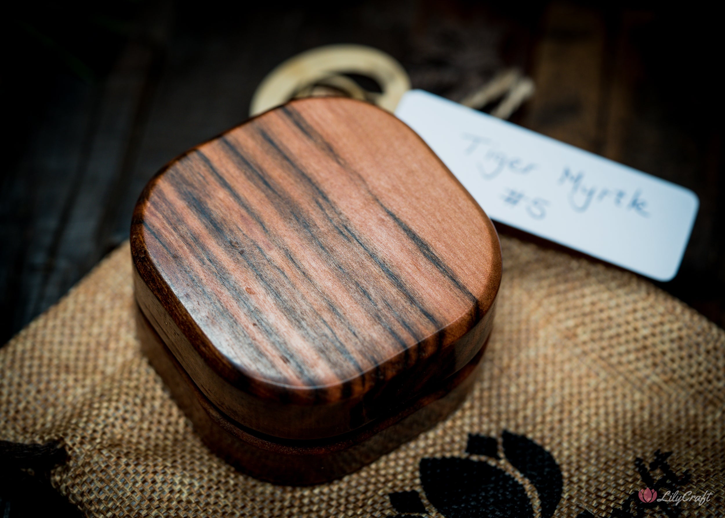 Detailed shot showcasing the craftsmanship of the wooden compass.