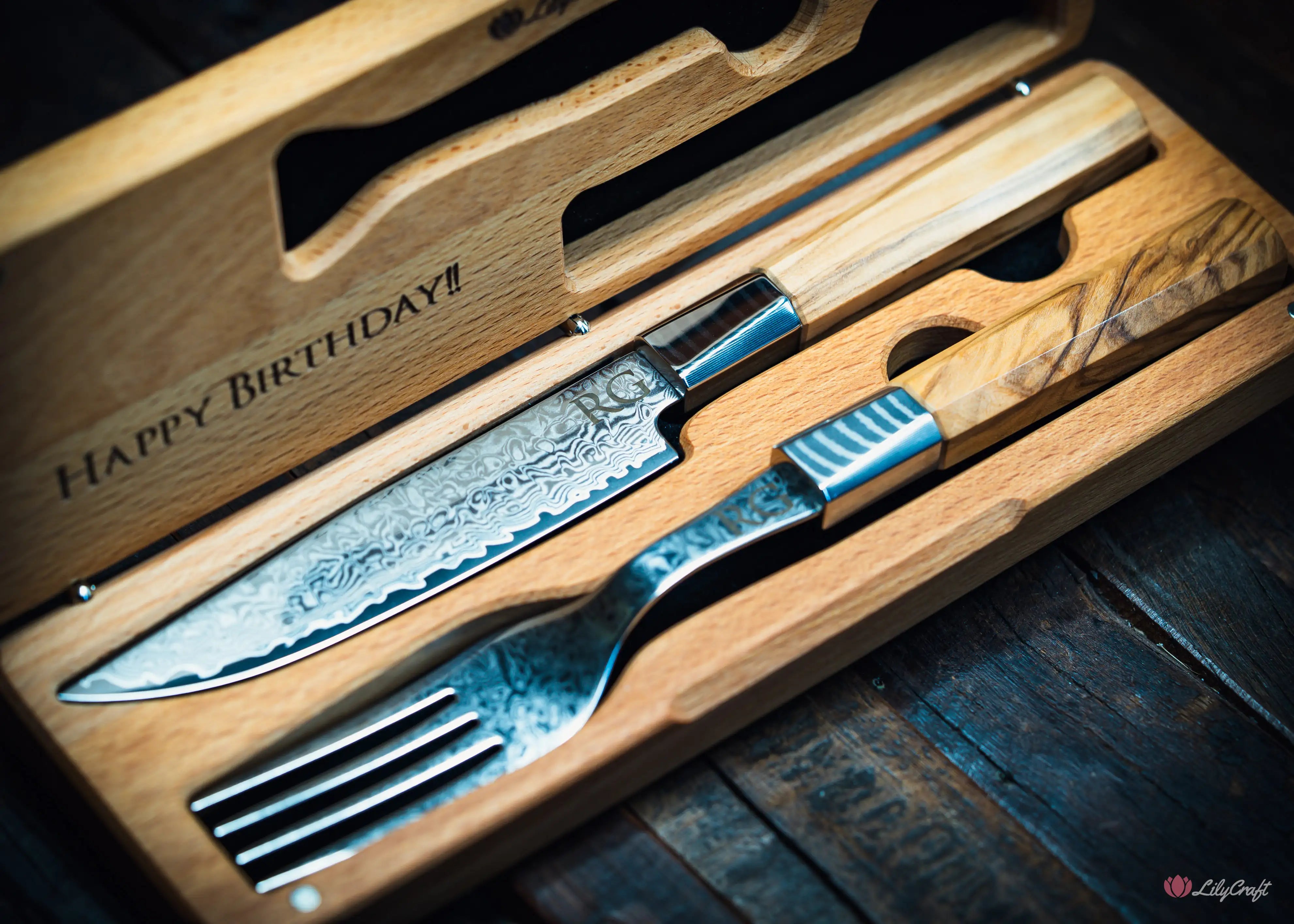 Premium Damascus steak knife and fork set with olive wood handles