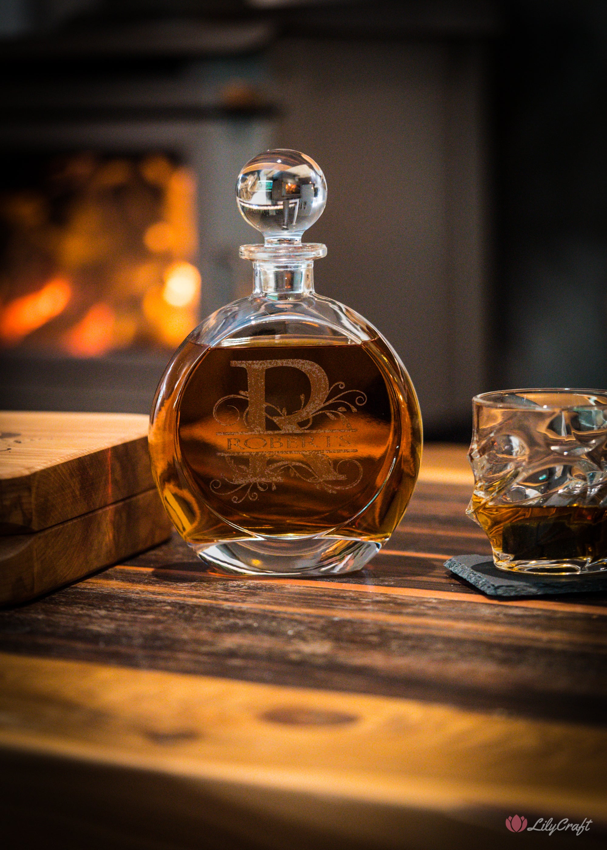 Elegant glass scotch decanter with custom wooden packaging.