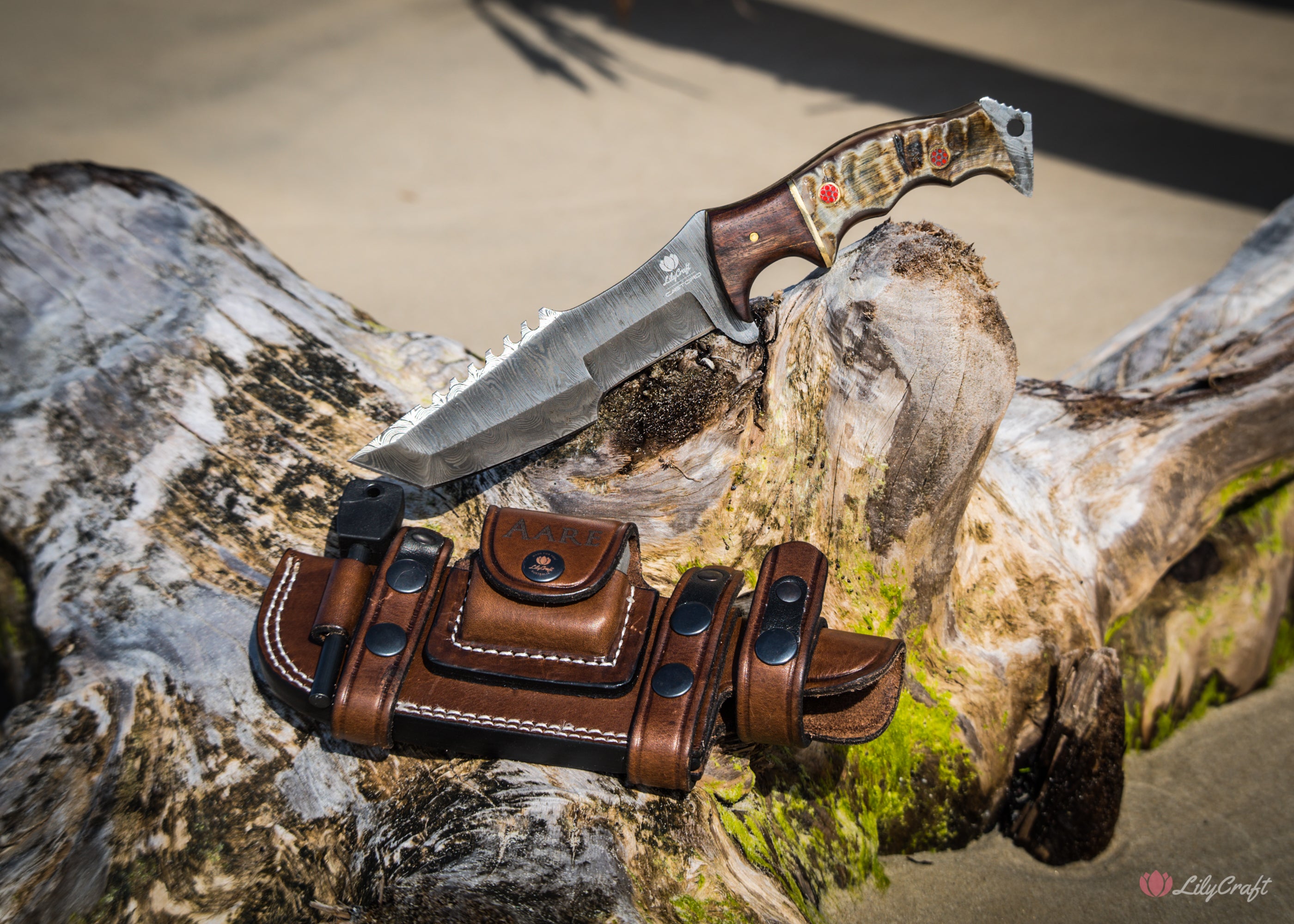 survival knife with leather sheath, sharpening stone and ferro rod