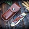 brass folding pocket knife with timber handle and leather sheath