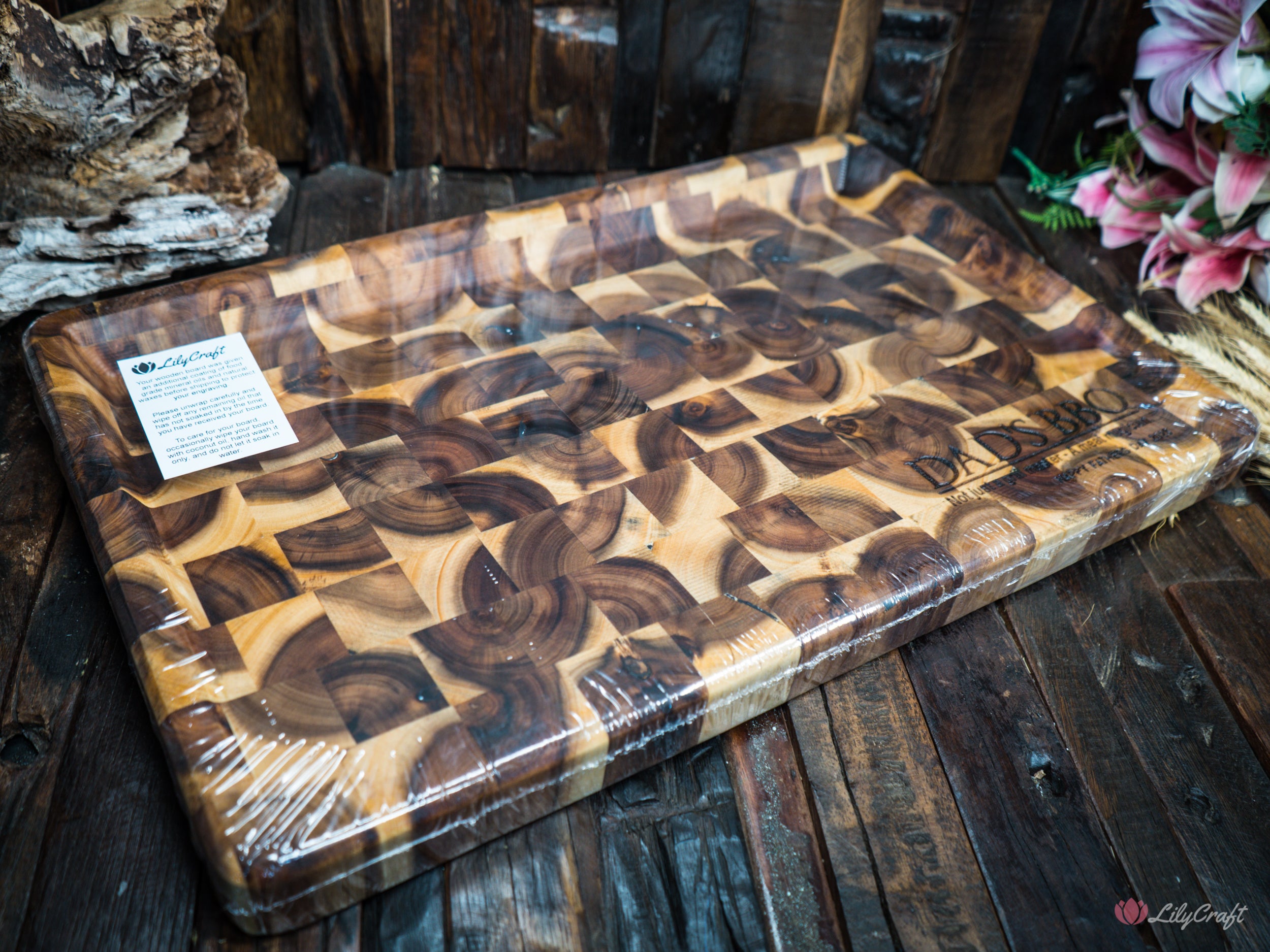 A sophisticated endgrain butcher's block BBQ cutting board with a natural wood grain finish.