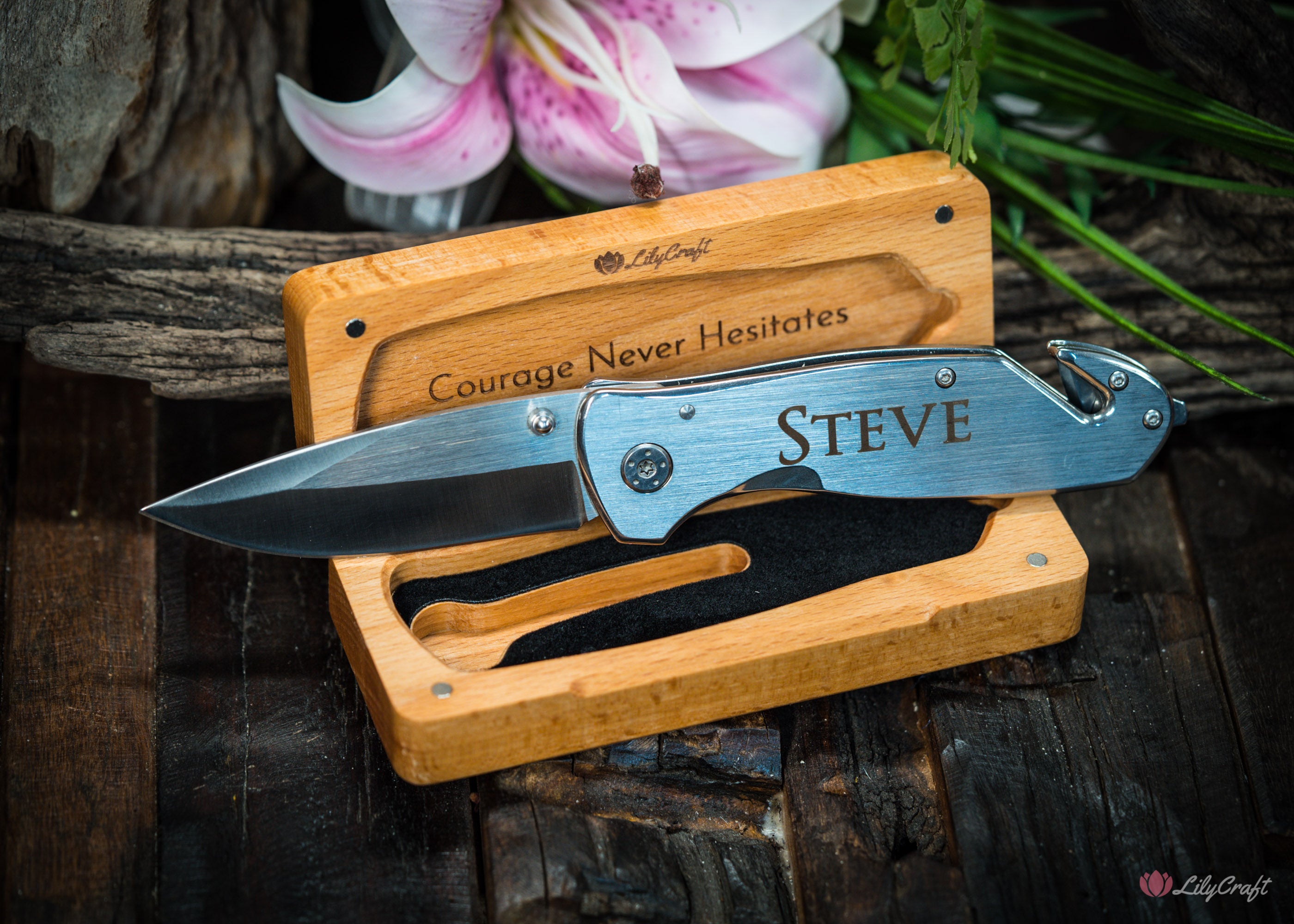 Engraved rescue knife with seatbelt cutter and glass breaker